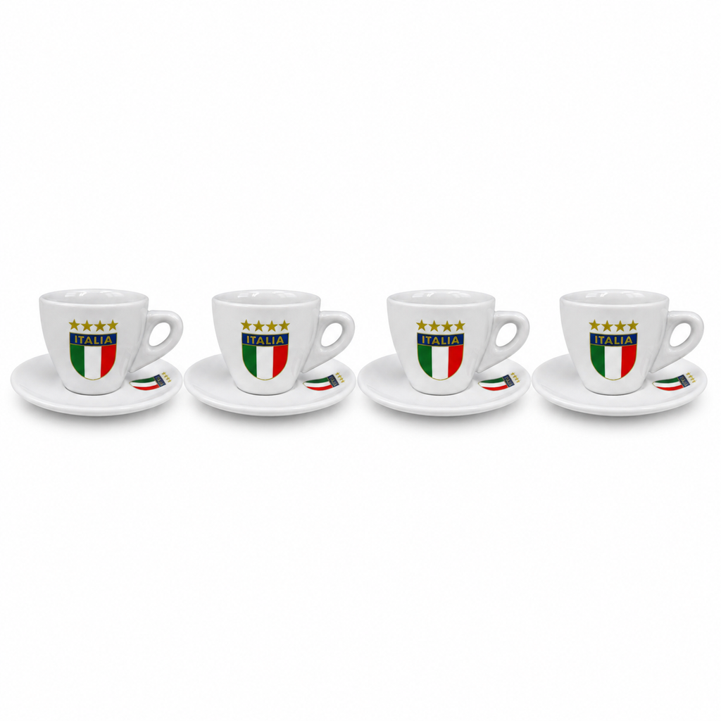 Four white espresso cups with matching saucers, each printed with the Italian flag, the word 'ITALIA', and four gold stars, arranged in a row on a white background.
