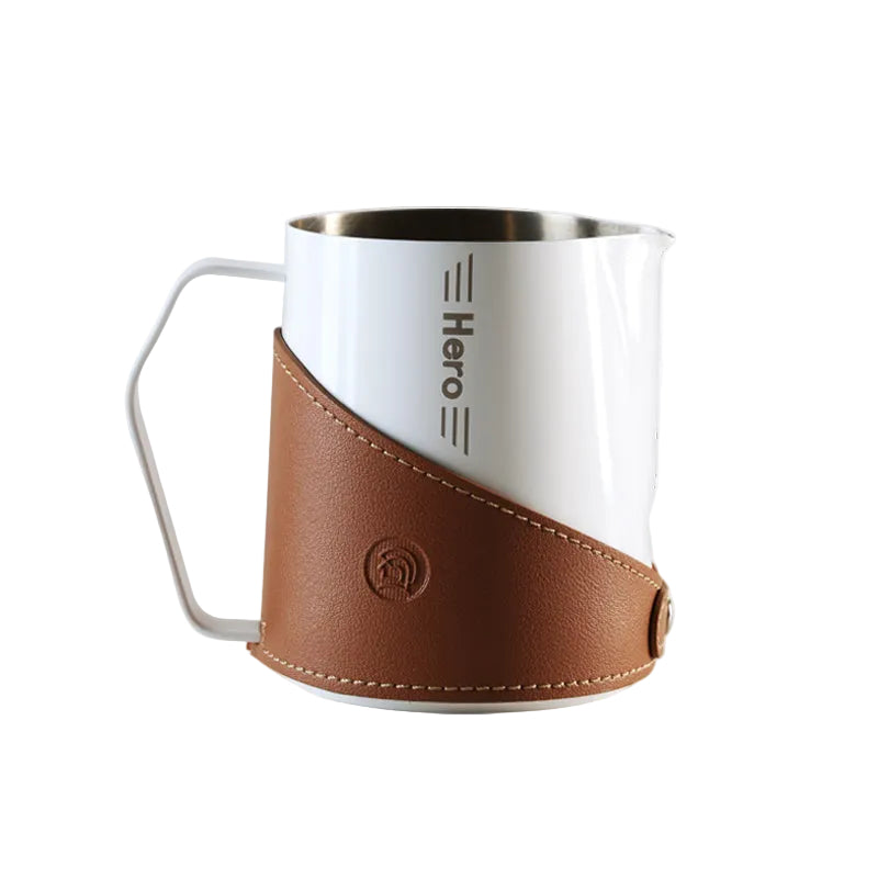 White mug with brown leather sleeve and 'Hero' branding on a white background