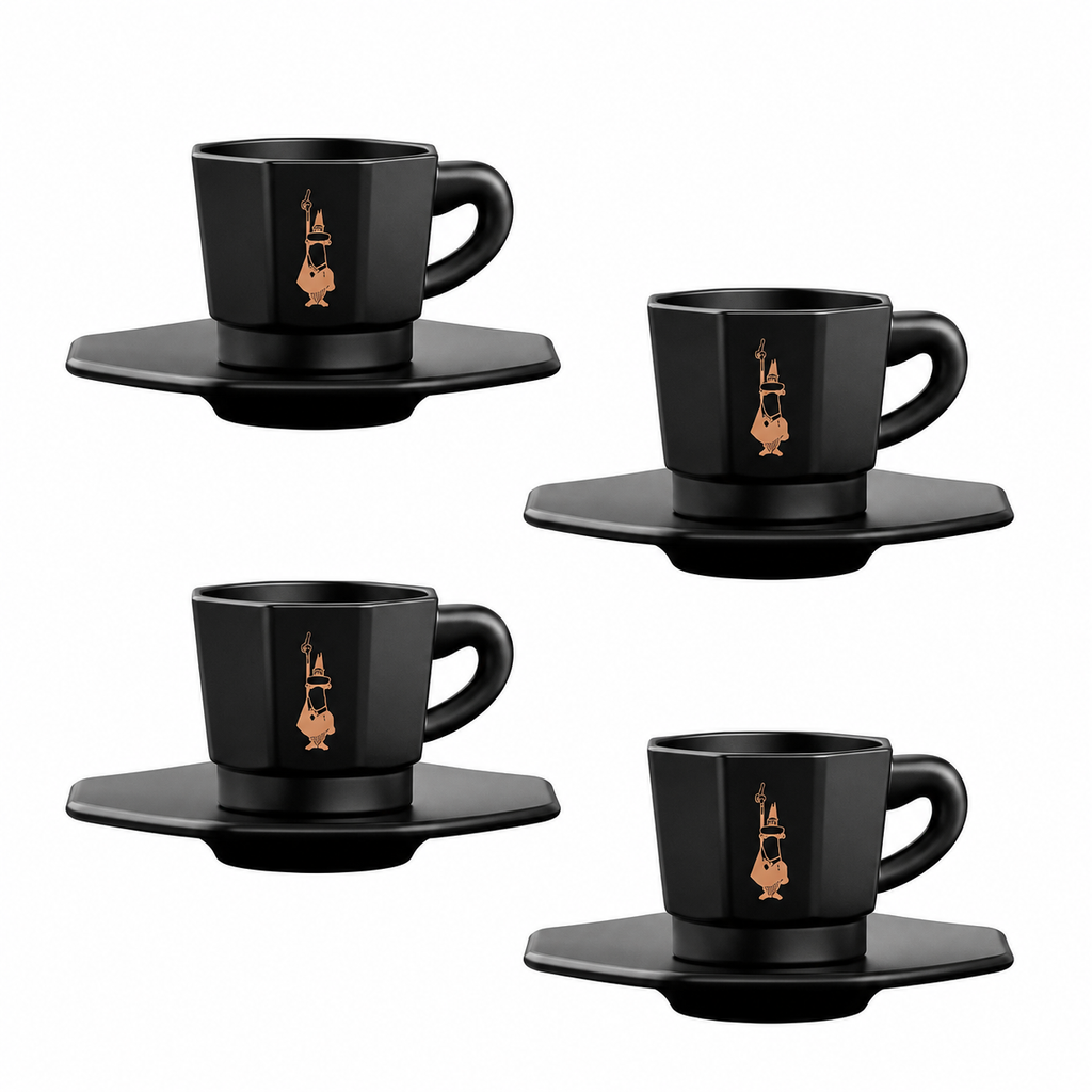 Four black ceramic espresso cups with matching saucers, each decorated with a small gold-toned illustration of a violin, arranged on a plain white background.