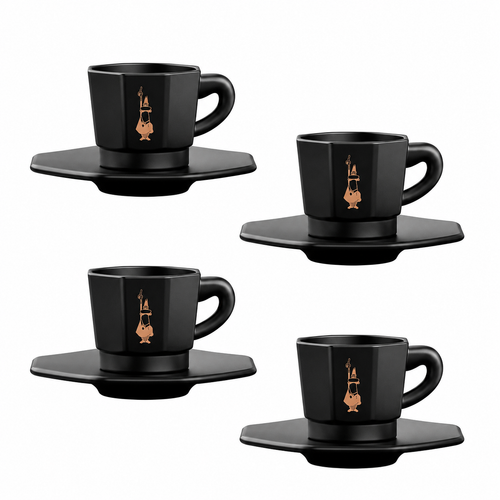 Four black ceramic espresso cups with matching saucers, each decorated with a small gold-toned illustration of a violin, arranged on a plain white background.