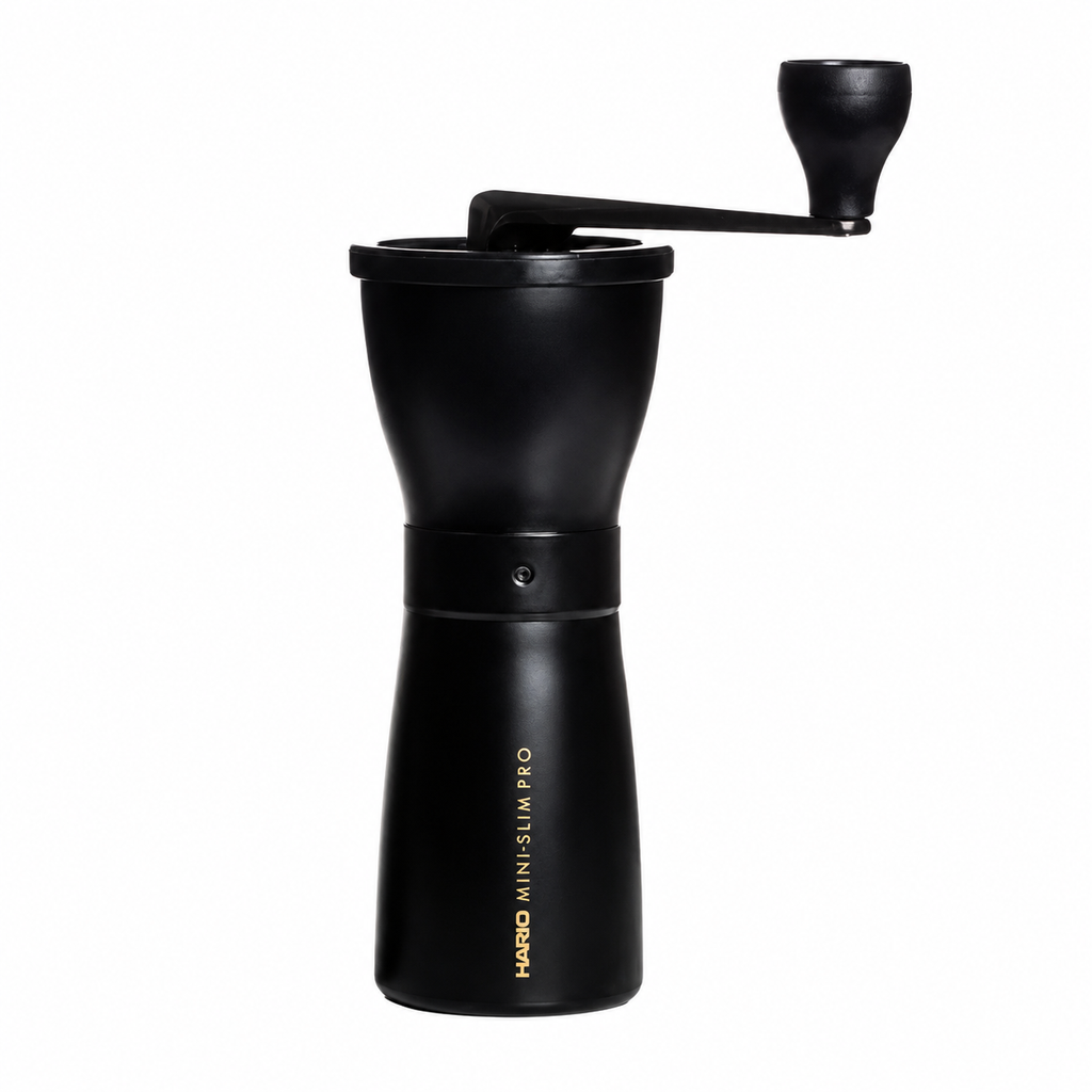 Hario Coffee Mill Slim Pro from Cirelli Coffee, a slim manual coffee grinder with stainless steel body, cast aluminium handle, ceramic conical burrs, adjustable grind coarseness and 24g roasted coffee capacity for home, office, travel and filter coffee brewing.
