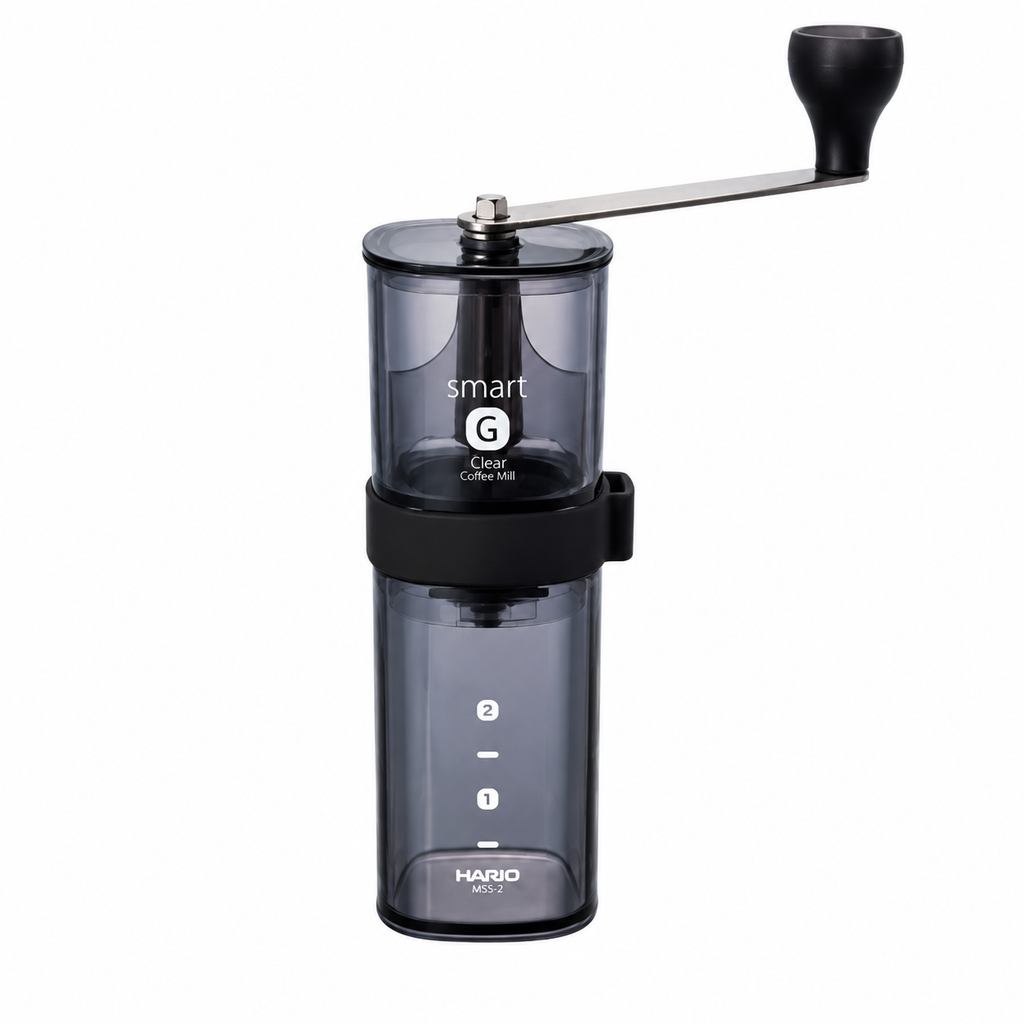 Hario Coffee Mill Smart G MSG-2-TB from Cirelli Coffee, a compact manual hand coffee grinder with BPA-free transparent black plastic body, ceramic conical burrs, adjustable grind settings and 24g coffee capacity for home, office, travel and filter coffee brewing.