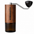 Comandante C40 Amber Grinder from Cirelli Coffee, a premium manual coffee grinder with NITRO BLADE heptagonal conical burrs, stainless steel construction, amber wood veneer finish and adjustable grind settings for espresso, pour over, AeroPress, French press, cold brew and specialty coffee brewing.