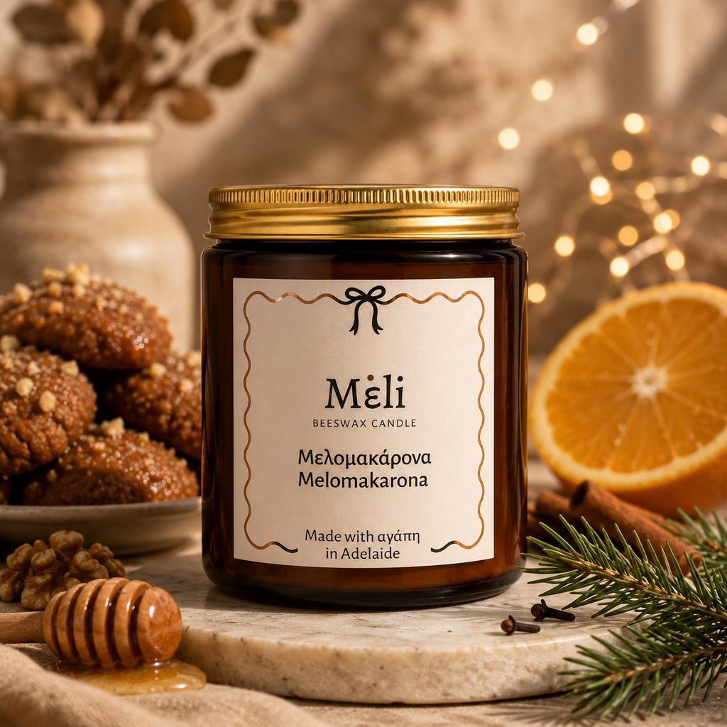 Meli Melomakarona Beeswax Candle 180g from Cirelli Coffee, a South Australian beeswax candle in a vintage amber jar with gold chrome lid, woodwick, 30-hour burn time, and warm honey, toasted walnut, cinnamon and clove fragrance notes.