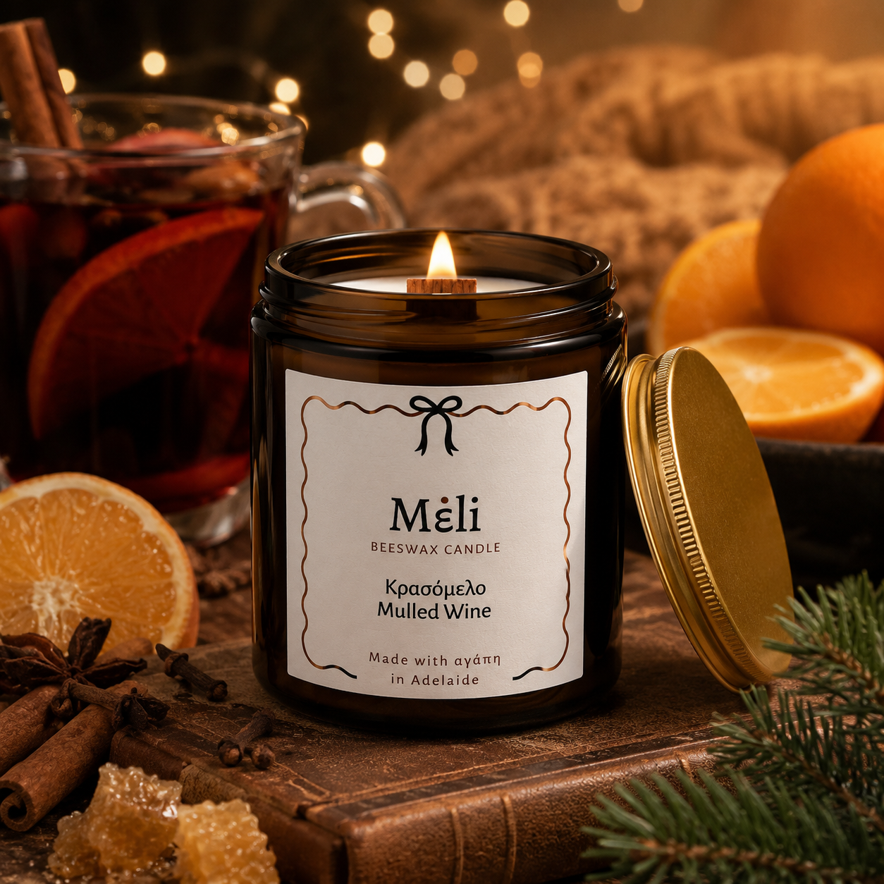 Meli Mulled Wine Beeswax Candle 180g from Cirelli Coffee, a South Australian beeswax candle in a vintage amber glass jar with gold lid, woodwick, 30-hour burn time, Brazilian orange essential oil, and warm fruit, honey, cinnamon, vanilla and spice fragrance notes.