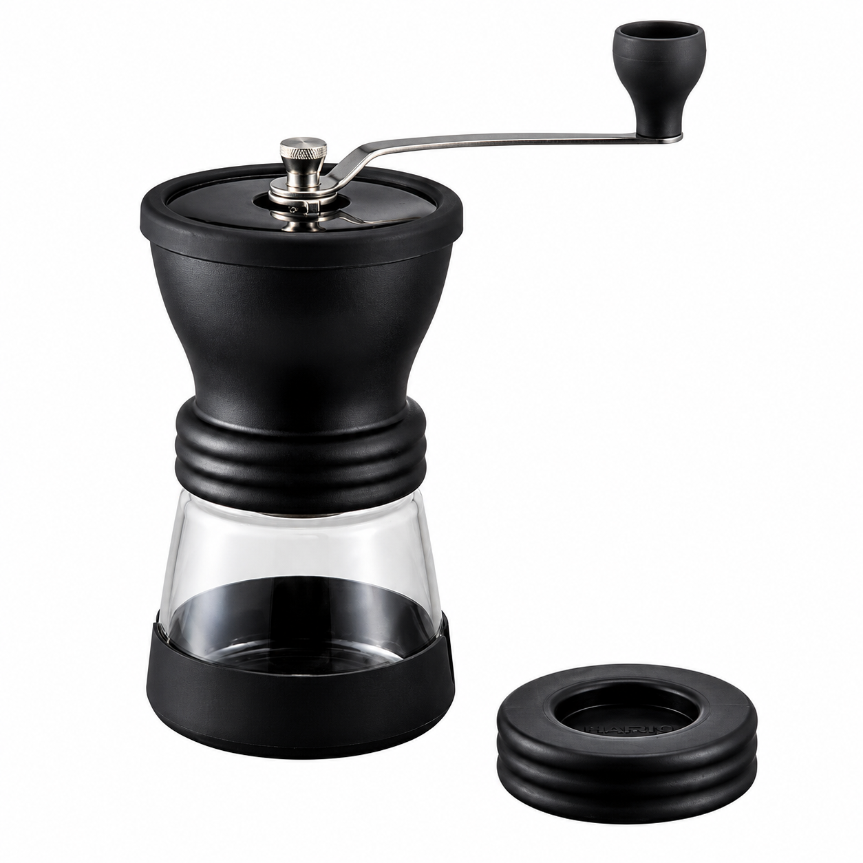 Hario Ceramic Coffee Mill Skerton Pro from Cirelli Coffee, a manual ceramic burr coffee grinder with improved grind adjustment, anti-slip grip, transparent lid, detachable stainless steel handle and glass bowl hopper for fresh home coffee brewing.