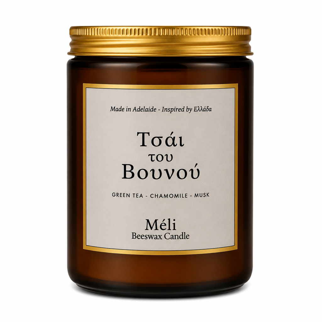 Meli Mountain Tea Tsai Tou Vonou Beeswax Candle 180g from Cirelli Coffee, a South Australian beeswax candle in a gloss amber jar with gold lid, wood wick, and calming green tea, chamomile and soft musk fragrance notes.