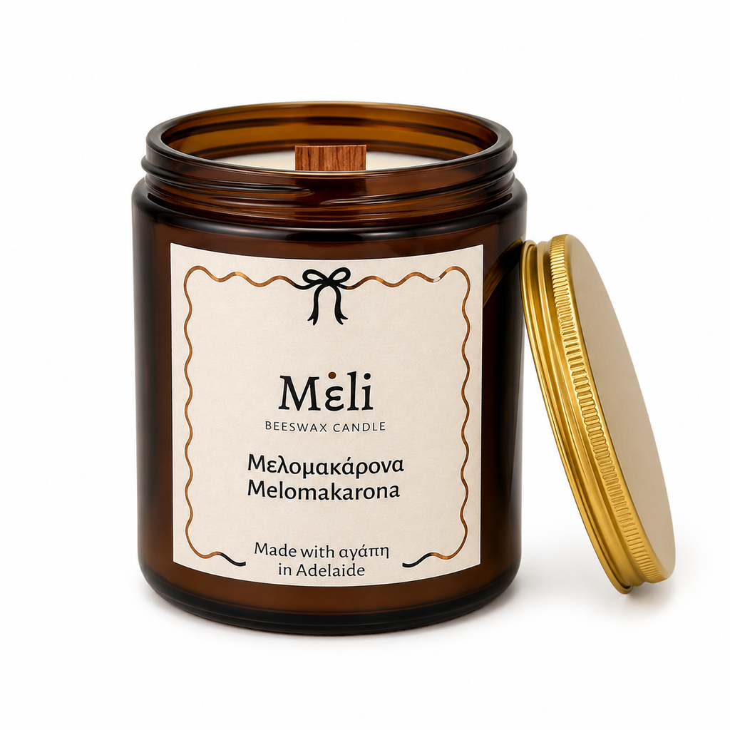 Meli Melomakarona Beeswax Candle 180g from Cirelli Coffee, a South Australian beeswax candle in a vintage amber jar with gold chrome lid, woodwick, 30-hour burn time, and warm honey, toasted walnut, cinnamon and clove fragrance notes.