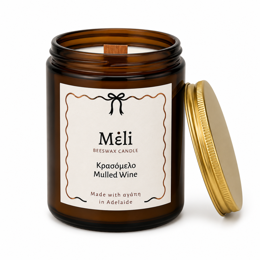 Meli Mulled Wine Beeswax Candle 180g from Cirelli Coffee, a South Australian beeswax candle in a vintage amber glass jar with gold lid, woodwick, 30-hour burn time, Brazilian orange essential oil, and warm fruit, honey, cinnamon, vanilla and spice fragrance notes.