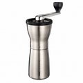 Hario Coffee Mill Slim Pro from Cirelli Coffee, a slim manual coffee grinder with stainless steel body, cast aluminium handle, ceramic conical burrs, adjustable grind coarseness and 24g roasted coffee capacity for home, office, travel and filter coffee brewing.