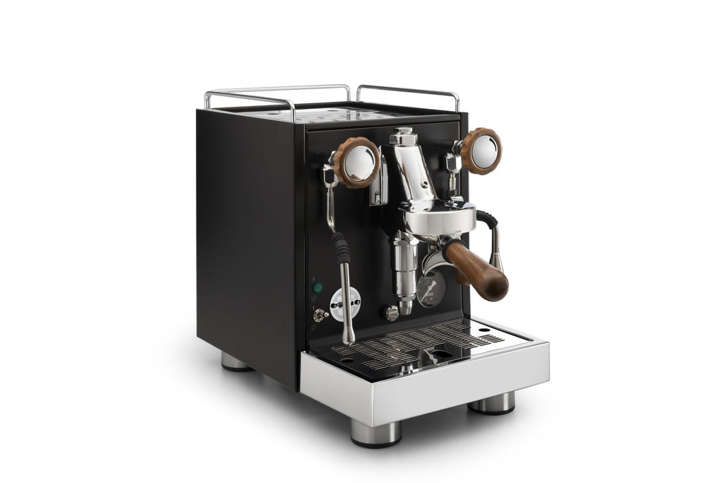 Wega W Mini Coffee Machine Bundle from Cirelli Coffee, a compact espresso machine package with professional brewing group, steam wand, hot water dispenser, adjustable spout, portafilters, tamper, milk jug, and cleaning accessories.